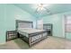 Main bedroom features a decorative bed frame, ceiling fan, and lots of natural light at 1619 E Silverbirch Ave, Buckeye, AZ 85326