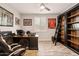 A modern office with a desk, custom built-ins, and decorative sports memorabilia at 16278 W Jenan Dr, Surprise, AZ 85379