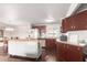 Bright kitchen featuring a kitchen island and stainless steel appliances that opens to a dining area at 17258 N 66Th Dr, Glendale, AZ 85308