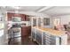 Modern kitchen with a center island and stainless steel appliances and hardwood floors at 17258 N 66Th Dr, Glendale, AZ 85308