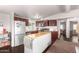 Well-lit kitchen featuring stainless steel appliances and a convenient kitchen island with a butcher block top at 17258 N 66Th Dr, Glendale, AZ 85308