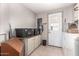 This laundry room features storage cabinets, a laundry sink and a washer and dryer at 17258 N 66Th Dr, Glendale, AZ 85308