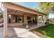 Inviting covered patio with ample space for outdoor seating and entertaining at 17634 W Hearn Rd, Surprise, AZ 85388