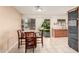 Bright dining area with tile floors and sliding door access to the backyard at 17634 W Hearn Rd, Surprise, AZ 85388