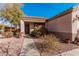 Inviting home exterior with desert landscape, charming facade, and well-maintained front yard at 17634 W Hearn Rd, Surprise, AZ 85388