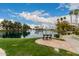 Beautiful lakeside view with a bench and walkway, perfect for relaxation and enjoying the serene surroundings at 1825 W Ray Rd # 2116, Chandler, AZ 85224