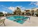 Resort-style pool and spa with lounge chairs and lush landscaping at 1825 W Ray Rd # 2116, Chandler, AZ 85224