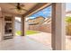 Covered back patio with ceiling fan overlooks private backyard area at 19075 E Pelican Dr, Queen Creek, AZ 85142