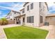 This grassy backyard features a patio, block wall, and low maintenance landscaping at 19075 E Pelican Dr, Queen Creek, AZ 85142