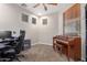 Bedroom with carpet, ceiling fan, and a piano at 19075 E Pelican Dr, Queen Creek, AZ 85142