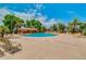 Large community pool with shade structures and plenty of lounge chairs at 19075 E Pelican Dr, Queen Creek, AZ 85142