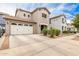 Two-story home with large driveway and manicured landscaping at 19075 E Pelican Dr, Queen Creek, AZ 85142