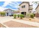 Two-story home featuring a neutral color scheme and tidy landscaping at 19075 E Pelican Dr, Queen Creek, AZ 85142