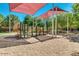 Community playground with shade structures and plenty of space to play at 19075 E Pelican Dr, Queen Creek, AZ 85142