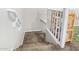 Carpeted stairs featuring a white railing leading to the second floor at 19075 E Pelican Dr, Queen Creek, AZ 85142