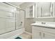 Well-lit bathroom features a shower-tub combo and vanity with drawers and sink at 2210 E Caspian Way, San Tan Valley, AZ 85140