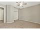 Neutral bedroom features carpet, ceiling fan, and a closet with shelving at 2210 E Caspian Way, San Tan Valley, AZ 85140