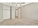 Bedroom features neutral color paint, carpet, and a closet with shelf at 2210 E Caspian Way, San Tan Valley, AZ 85140