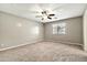 Bedroom with carpet flooring, ceiling fan and window for natural light at 2210 E Caspian Way, San Tan Valley, AZ 85140