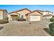 A well-maintained single-Gathering home with a desert landscape and a two-car garage at 2210 E Caspian Way, San Tan Valley, AZ 85140