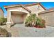 Inviting front porch with desert landscaping leading to the front door at 2210 E Caspian Way, San Tan Valley, AZ 85140