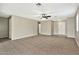 Large living room with tile floors, neutral walls, and a view of the front door at 2210 E Caspian Way, San Tan Valley, AZ 85140