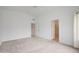 Bright bedroom with neutral carpet, ceiling fan, and a glimpse into the attached bathroom at 2416 E Cielo Grande Ave, Phoenix, AZ 85024