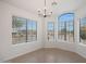 Sunlit dining room featuring large windows that enhance the inviting atmosphere at 2416 E Cielo Grande Ave, Phoenix, AZ 85024