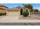 Charming single-story home featuring a tile roof, landscaped front yard, and a two-car garage at 2416 E Cielo Grande Ave, Phoenix, AZ 85024