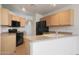 Well-equipped kitchen featuring wooden cabinets and countertops, perfect for home cooking at 2416 E Cielo Grande Ave, Phoenix, AZ 85024