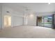 Bright living room with white walls, a ceiling fan, and sliding glass doors to the backyard at 2416 E Cielo Grande Ave, Phoenix, AZ 85024