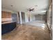 View from the kitchen to the carpeted living room with multiple ceiling fans and patio access at 2539 E Hazeltine Way, Chandler, AZ 85249