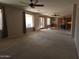 Spacious living room featuring neutral carpet, ceiling fans and tons of natural light at 2539 E Hazeltine Way, Chandler, AZ 85249