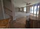 View from the kitchen to the spacious living room with many ceiling fans and patio doors at 2539 E Hazeltine Way, Chandler, AZ 85249