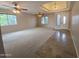 Bright, open living room featuring tile flooring, a front door, and multiple windows at 2539 E Hazeltine Way, Chandler, AZ 85249