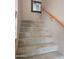 Carpeted staircase with wooden handrail and decorative mirror at 2539 E Hazeltine Way, Chandler, AZ 85249