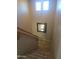 Carpeted staircase with wooden handrail and decorative mirror at 2539 E Hazeltine Way, Chandler, AZ 85249