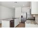 Well-lit kitchen with granite countertops, stainless steel appliances, and a central island at 25401 W Sunland Ave, Buckeye, AZ 85326