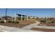 The community park with playground provides recreational space and adds value to the neighborhood at 25401 W Sunland Ave, Buckeye, AZ 85326