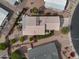 Aerial view of a well-maintained home with desert landscaping, mature trees and a private backyard at 2568 N Armour Ave, Mesa, AZ 85215