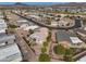 Scenic aerial view of a well-maintained residential neighborhood surrounded by palm trees with mountain views in the background at 2568 N Armour Ave, Mesa, AZ 85215