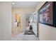 Inviting foyer with tiled floor leading to an open-concept living space and a glimpse of the laundry room at 2568 N Armour Ave, Mesa, AZ 85215