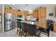 Spacious kitchen featuring a large center island with granite countertops and stainless steel appliances at 2568 N Armour Ave, Mesa, AZ 85215