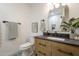 Well-appointed bathroom with modern vanity, decorative mirror, and neutral color scheme at 2902 E Pierson St, Phoenix, AZ 85016