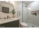 The bathroom features a modern sink and faucet, a bright shower, and trendy decorations at 2902 E Pierson St, Phoenix, AZ 85016