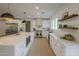 Bright kitchen with white cabinets, stainless steel appliances, and a large island at 2902 E Pierson St, Phoenix, AZ 85016