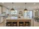 Spacious kitchen with a large island, modern pendant lights, and stainless steel appliances at 2902 E Pierson St, Phoenix, AZ 85016