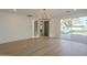 Bright living room with hardwood floors, a sliding glass door to backyard, and neutral color palette at 2902 E Pierson St, Phoenix, AZ 85016