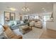 Bright and airy living room featuring modern lighting, hardwood floors, and comfortable seating at 2902 E Pierson St, Phoenix, AZ 85016