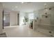 Luxurious bathroom featuring a glass enclosed shower, freestanding tub, and sleek modern design at 2902 E Pierson St, Phoenix, AZ 85016